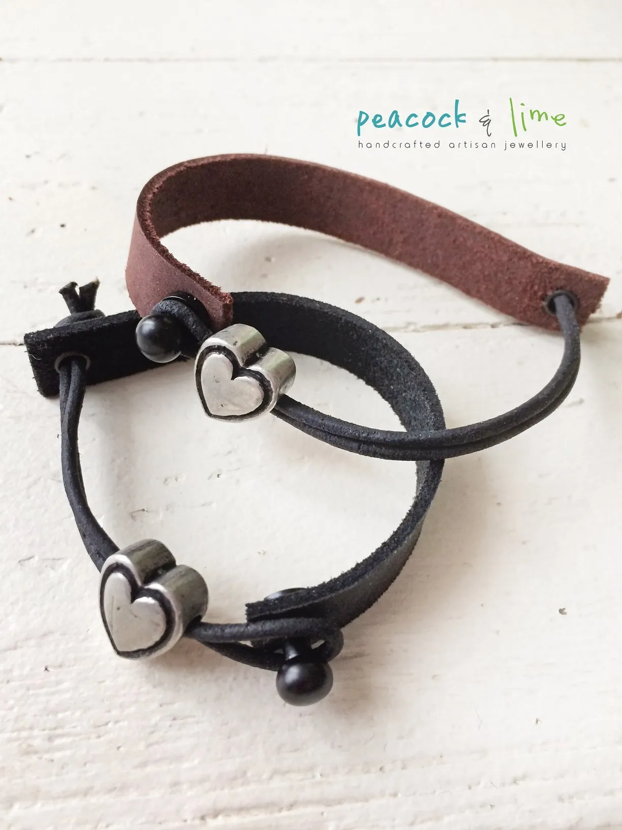 simple modern single strap leather bracelet with pewter heart slider