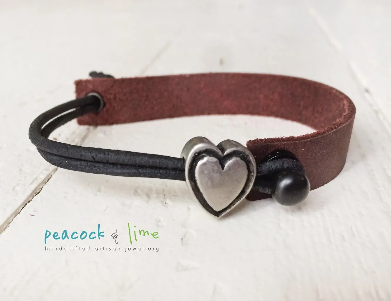 simple modern single strap leather bracelet with pewter heart slider